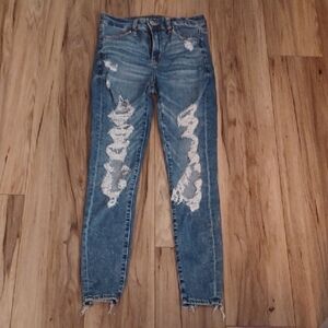 J1 - American Eagle Outfitters Light Blue Distressed Skinny Jeans. Size 4